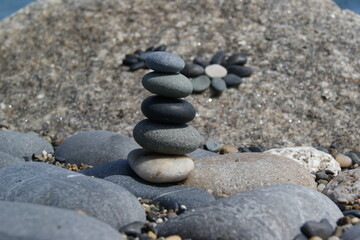Fototapeta na wymiar Zen stone tower made of flat pebbles.