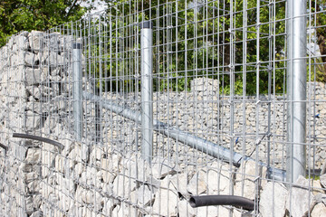unfinished gabion fence