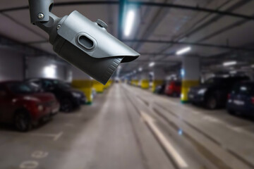 Obraz premium CCTV camera or surveillance system on indoor car parking.