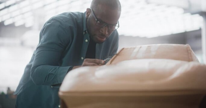 Diverse African Automotive Artist Making Final Strokes on His Latest Concept Car Creation. Black Designer Working on a New Prototype, Sculpting Industrial Plasticine Clay 3D Model of a Luxury Coupe