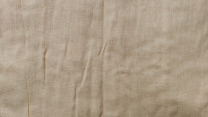 Abstract background and texture from yellow linen fabric, made from linen fibers