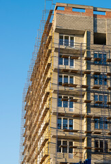 Construction of a multi-storey residential building, scaffolding