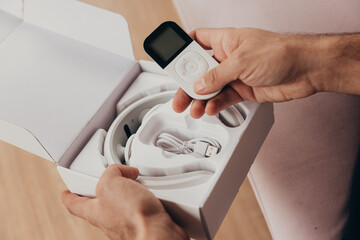Man unbox a neck device massager