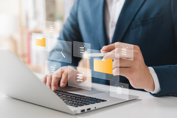 Document management system concept, business man touch folder and document icon software, searching and managing files online document database, for efficient archiving and company data.