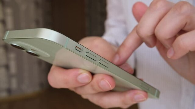Woman using smartphone pressing finger, reading social media internet, typing text or shopping online. Mobile phone at home or work. High quality FullHD footage