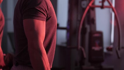 Taking weight lifting in sport club. Man lifting weights. Performing strength, power and endurance exercises with a barbell.