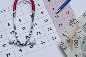 Kalendarz z długopisem stetoskopem oraz gotowką - obrazy, fototapety, plakaty