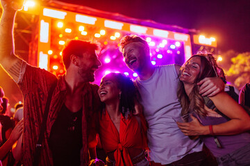 Friends enjoying concert.