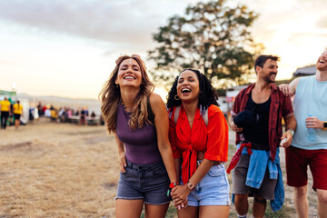Joyful friends at summer day festival