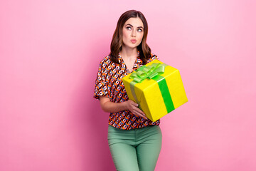 Photo of young minded brainstorming lady pouted lips looking interested empty space hold gift best...