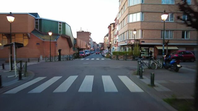 Real time dashcam footage of a car driving on the road in the afternoon in Brussels, Belgium