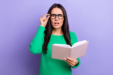 Portrait of intelligent business lady wear green jumper fix her glasses reading diary own daughter bad stories isolated on violet color background