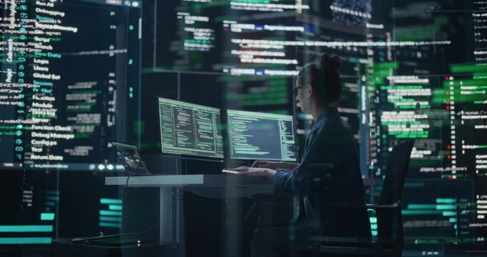 Dolly Shot of Female Programmer Working in a Monitoring Control Room, Surrounded by Big Screens Displaying Lines of Programming Language Code. Portrait of Woman Creating a Software and Coding