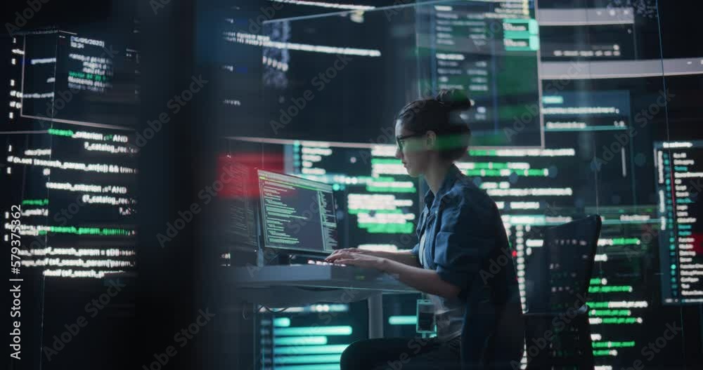Poster Dolly Shot of Female Programmer Working in a Monitoring Control Room, Surrounded by Big Screens Displaying Lines of Programming Language Code. Portrait of Woman Creating a Software and Coding