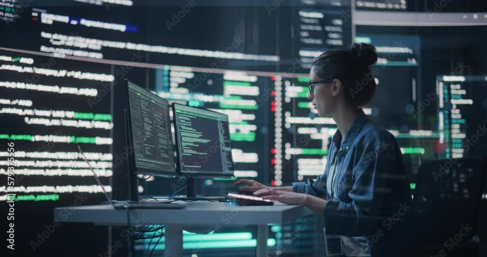 Poster Portrait of Woman Working on Computer, Typing Lines of Code that Appear on Big Screens Surrounding her in a Monitoring Room. Female Programmer Creating Innovative Software Using AI Data and System