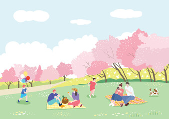 Obraz na płótnie Canvas People enjoying picnics on the grass on a sunny spring day when cherry blossoms are in full bloom