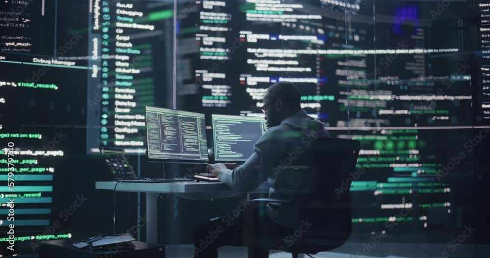 Fototapete Black Male Developer Thinking and Typing on Computer, Surrounded by Big Screens Showing Coding Language. Professional Programmer Creating Software, Running Coding Tests. Futuristic Programming Concept