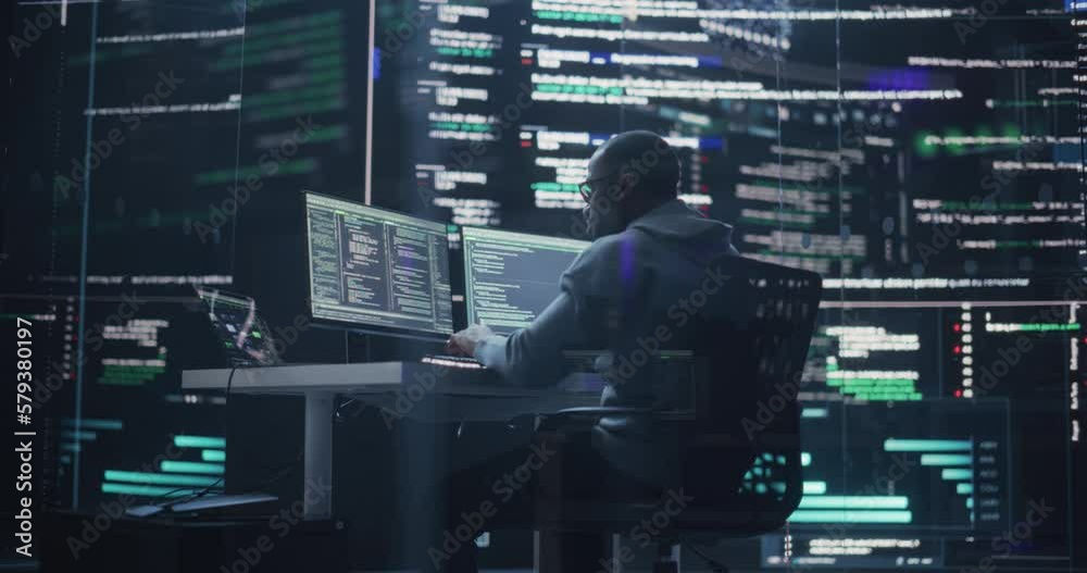 Aufkleber Portrait of a Black Man Working on Computer, Typing Lines of Code that Appear on Big Screens Surrounding him in Monitoring Room. Male Programmer Creating Innovative Software Using AI Data and System