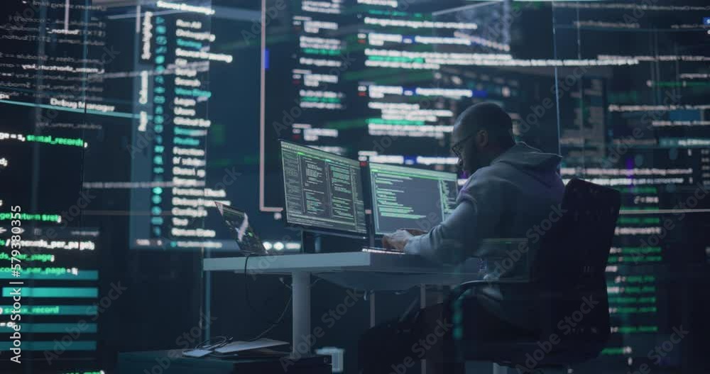 Fototapete Black Male Developer Thinking and Typing on Computer, Surrounded by Big Screens Showing Coding Language. Professional Programmer Creating Software, Running Coding Tests. Futuristic Programming Concept