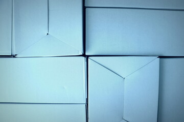 Cardboard boxes seamless pattern on blue background.
