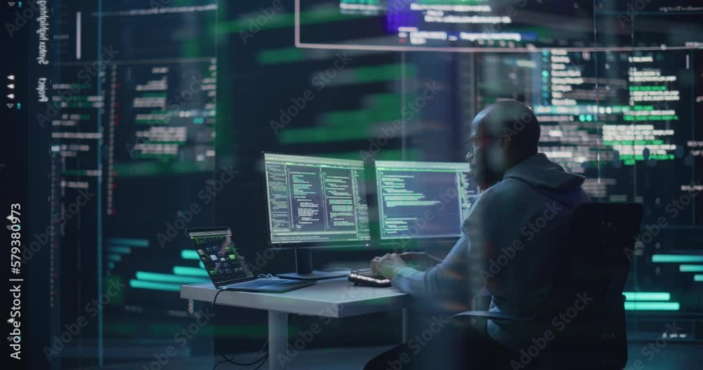 Fototapete Black Male Developer Typing on Computer, Surrounded by Transparent Screens Showing Code Lines. Professional Programmer Creating Software, Running Coding Tests. Futuristic Programming Concept