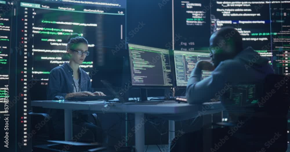Fototapete Portrait of Two Programmers Working in a Monitoring Control Room, Surrounded by Big Screens Displaying Lines of Programming Language Code. Portrait of Diverse Developers Creating a Software and Coding