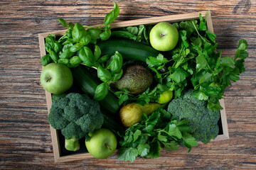 green healthy vegetables and herbs in a box