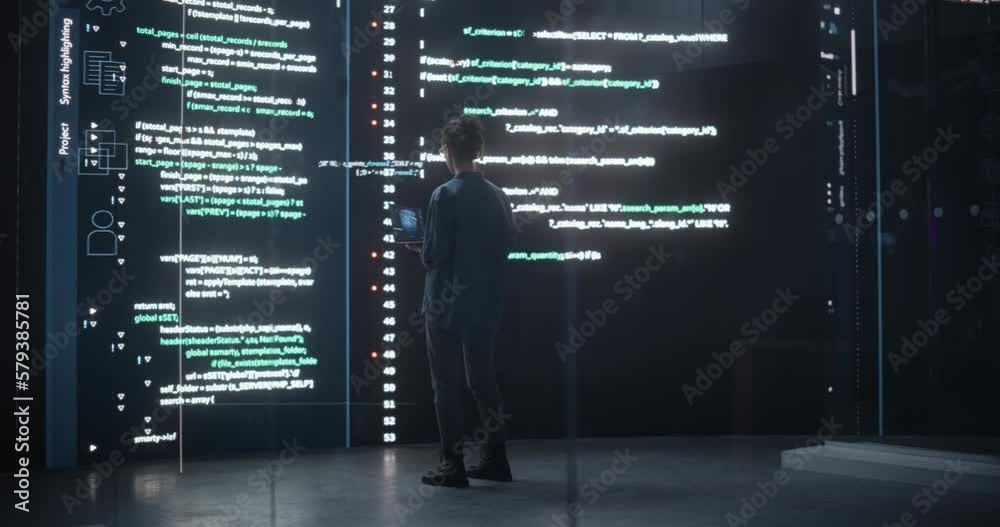 Aufkleber Portrait of Young Woman Working on Laptop Computer, Looking at Big Digital Screen Displaying Back-end Code Lines. Professional Programmer Developing a Big Data Interface Software Project