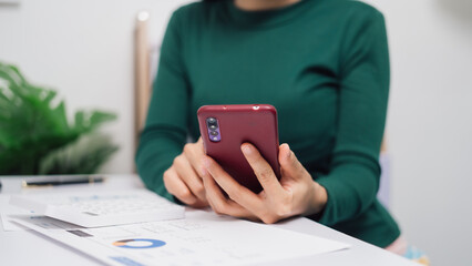 Young Asian household woman busy with bills and taxation, using calculator, make payment on tablet of family budget.