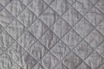 Fototapeta premium Textura de tela gris, textura edredón, con rombos