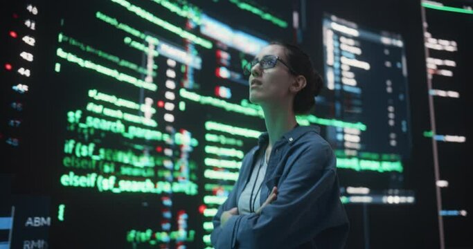 Portrait of Young Woman Looking at Big Digital Screens Glitching While Displaying Code Lines. Worried Professional Programmer Trying to Fix a Bug, Dealing with Crashing System, Thinking of Solutions