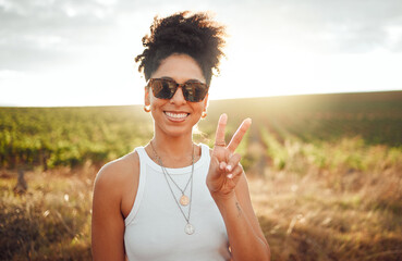 Peace sign, travel and black woman on safari holiday during summer in Kenya. Portrait of a happy, relax and African girl with hand for photo, adventure and happiness on vacation in the countryside