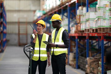 Worker Doing Inventory in Warehouse. Dispatcher in uniform making inventory in storehouse. supply chain concept
