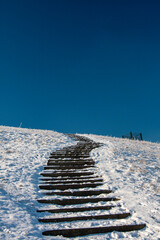stairs in hiking area covered with snow