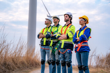 Wind turbine service engineer maintenance and plan for inspection at construction site, renewable electricity generator.