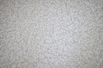 The texture of a white, soft, cozy carpet. Snow-white carpet for a close -up floor. Hypoallergenic carpet the best flooring.
