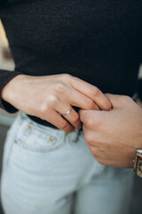 close up of a person holding a ring