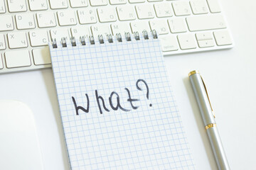The word that is written with a question mark in a notebook