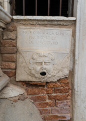 Architectural detail of a mailbox to denounce illicit activities of citizens in Venice, Italy 