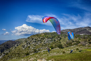 Paragliding concept, paraglider pilot fly in sky on beauty nature mountain landscape Norma Italy...