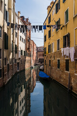 Obraz na płótnie Canvas A beautiful and charming view of a canal in Venice, Italy, during early spring showing its typical architecture 