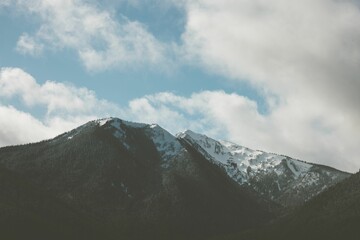 Fototapeta na wymiar Closeup of a snow-covered mount peak for cool background