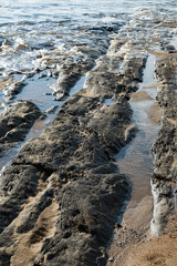 Sea and sand on the rocks