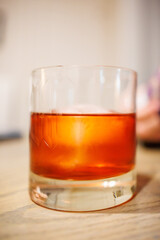 Icey Negroni in glass on table