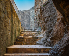 castle of loarre spain escavada stairway on the rocks towards the parade ground