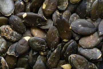 Top view closeup shot of a heap of pumpkin seeds