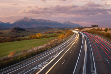 evening highway with light paths under Krivan hill, High Tatras,Slovakia