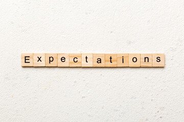expectation word written on wood block. expectation text on table, concept