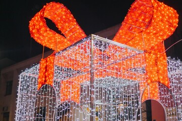 Large gift box structure covered by lights for Christmas decoration