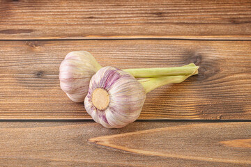 Two Young garlic over background